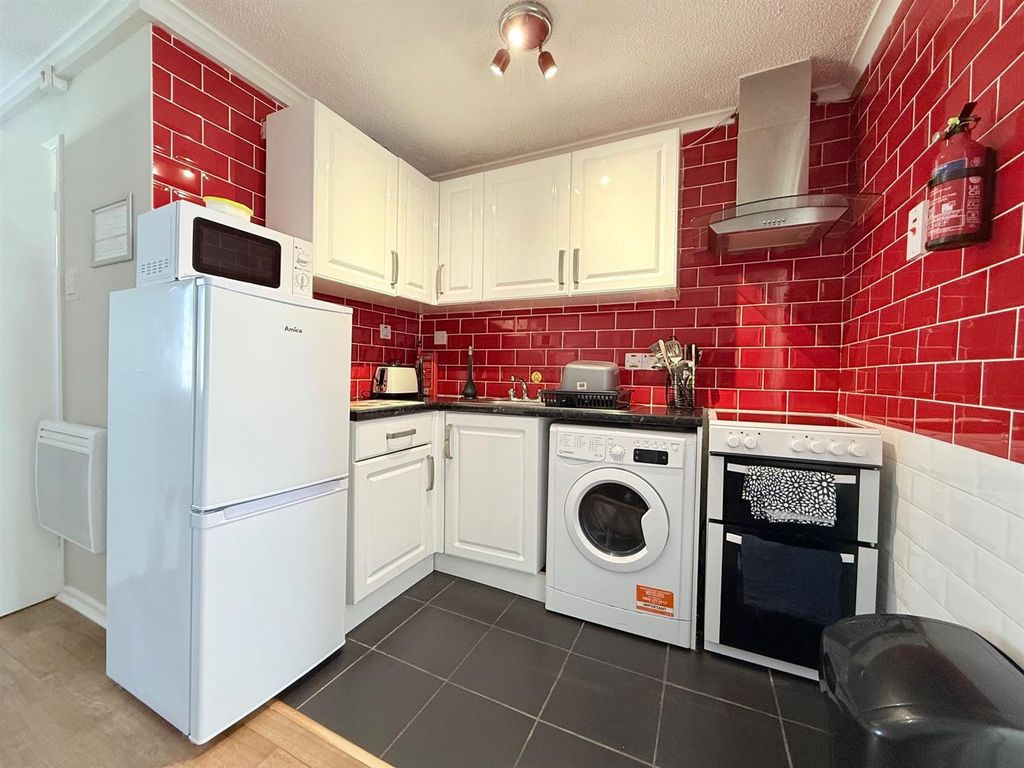 Property photo 2 of 8 Kitchen Area