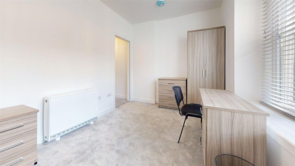Property photo 1 of 8 Bright And Clean Bedroom Featuring A Desk, Wardrob...