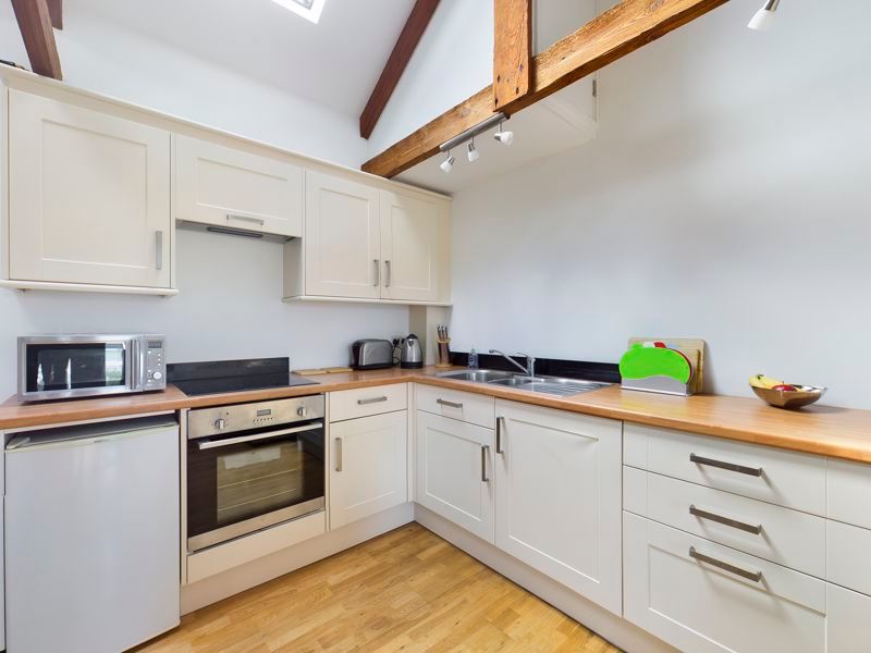 Property photo 3 of 9 Kitchen Area