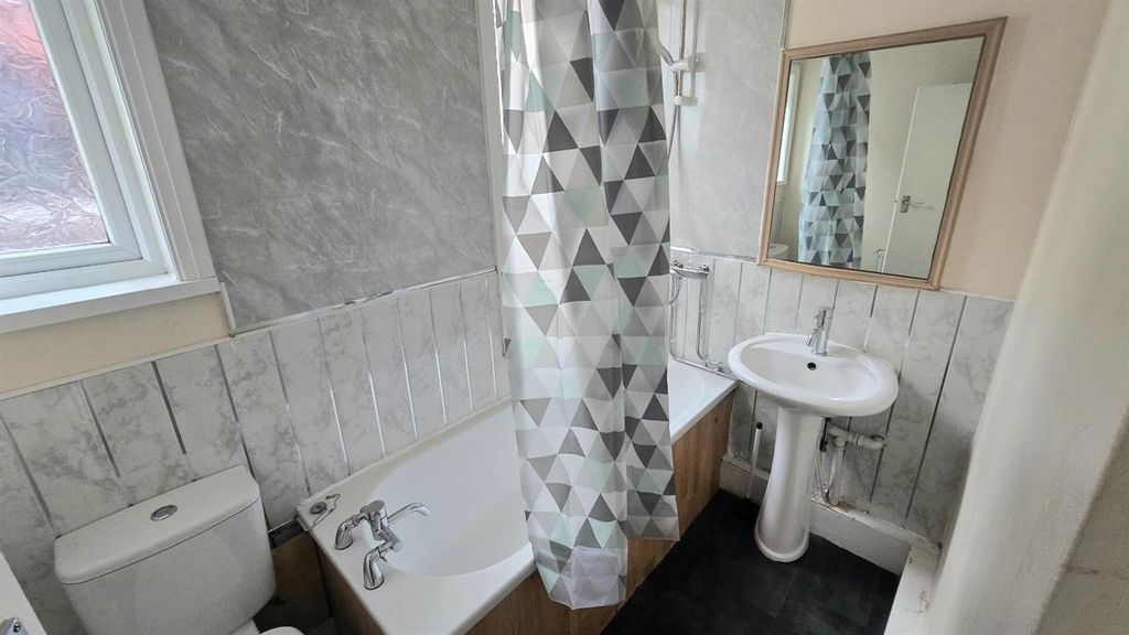 Property photo 3 of 11 Bright Bathroom With Bath And Pedestal Sink...