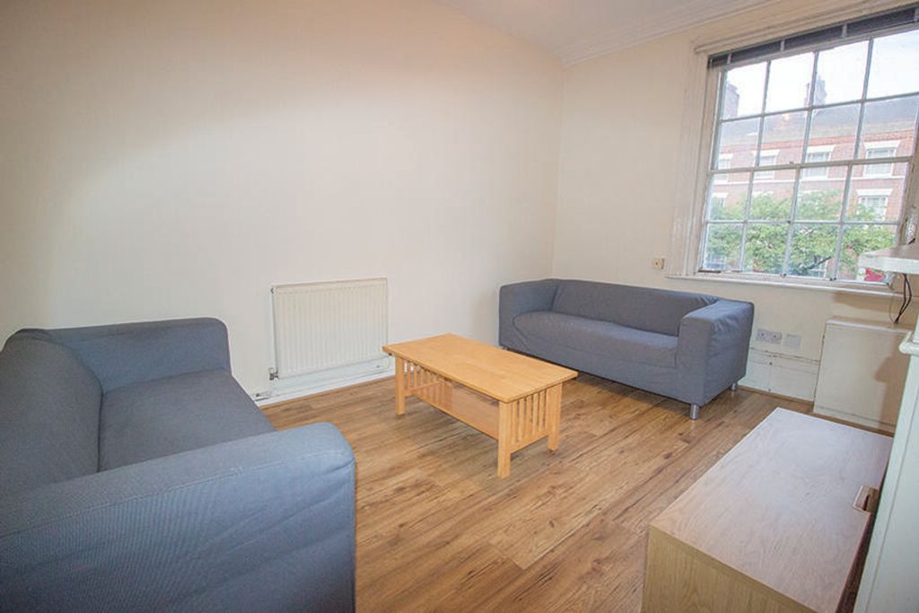 Property photo 1 of 5 Bright And Inviting Living Room Featuring Comforta...