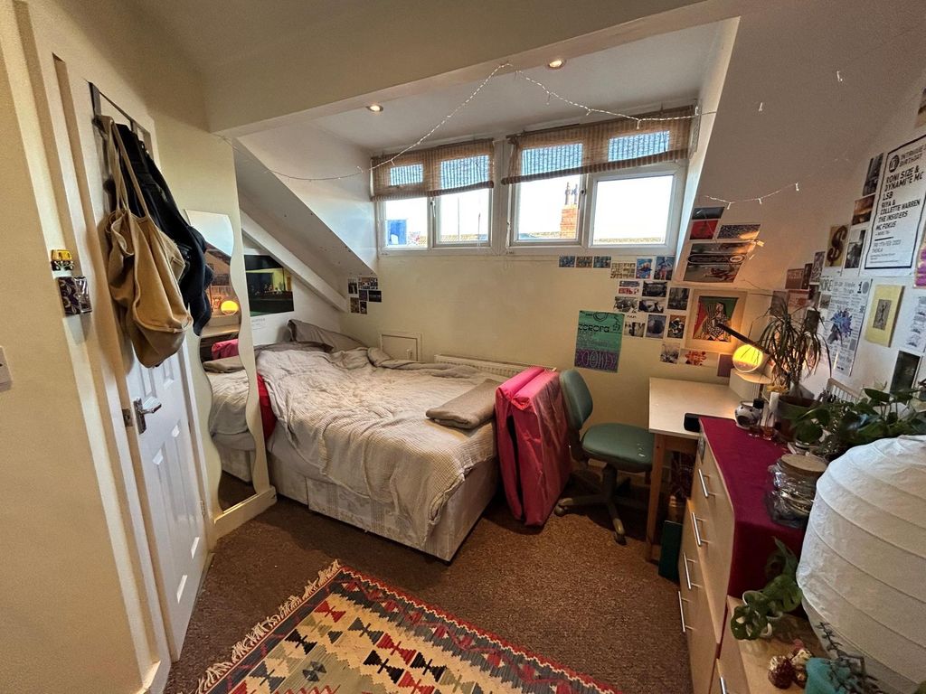 Property photo 2 of 14 A Cozy Bedroom Featuring A Comfortable Double Bed,...