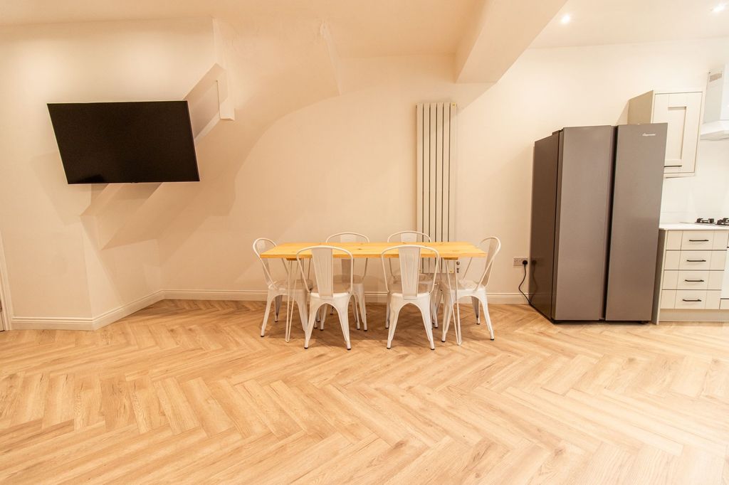 Property photo 3 of 20 Bright And Modern Living Area Featuring A Large Wa...