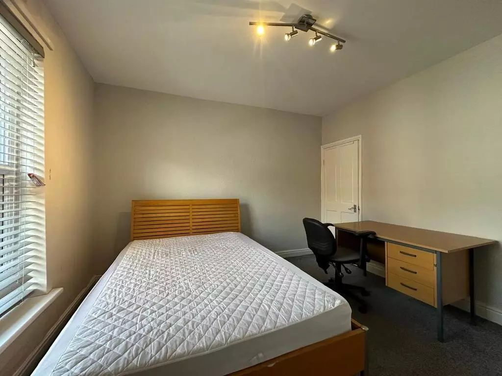 Property photo 3 of 16 A Tidy Double Bedroom Featuring A Wooden Bed Frame...