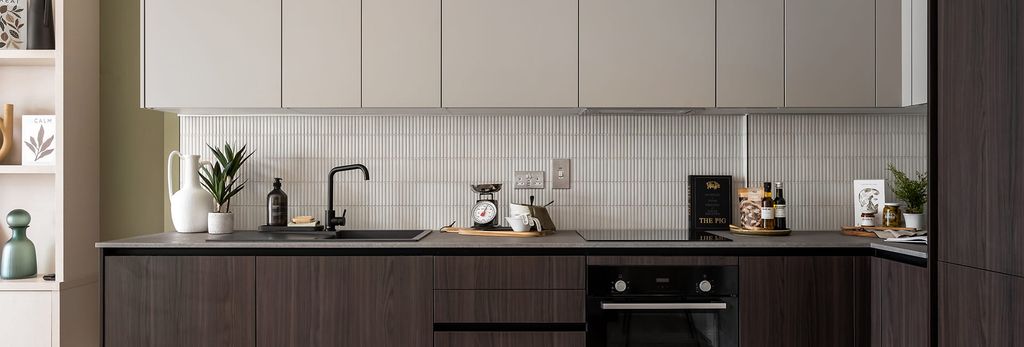 Property photo 2 of 4 Kitchen Area With White Splashback Tiles And White And Mahogany Brown Cupboards.