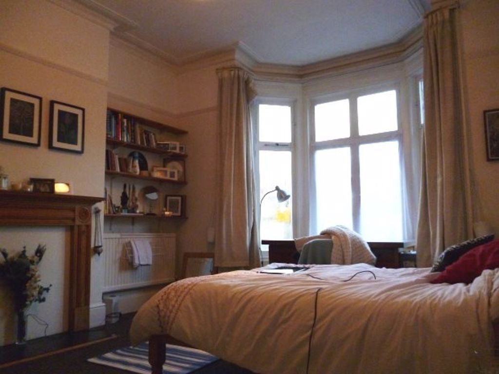 Property photo 3 of 12 A Cozy Bedroom Featuring A Large Window Allowing N...