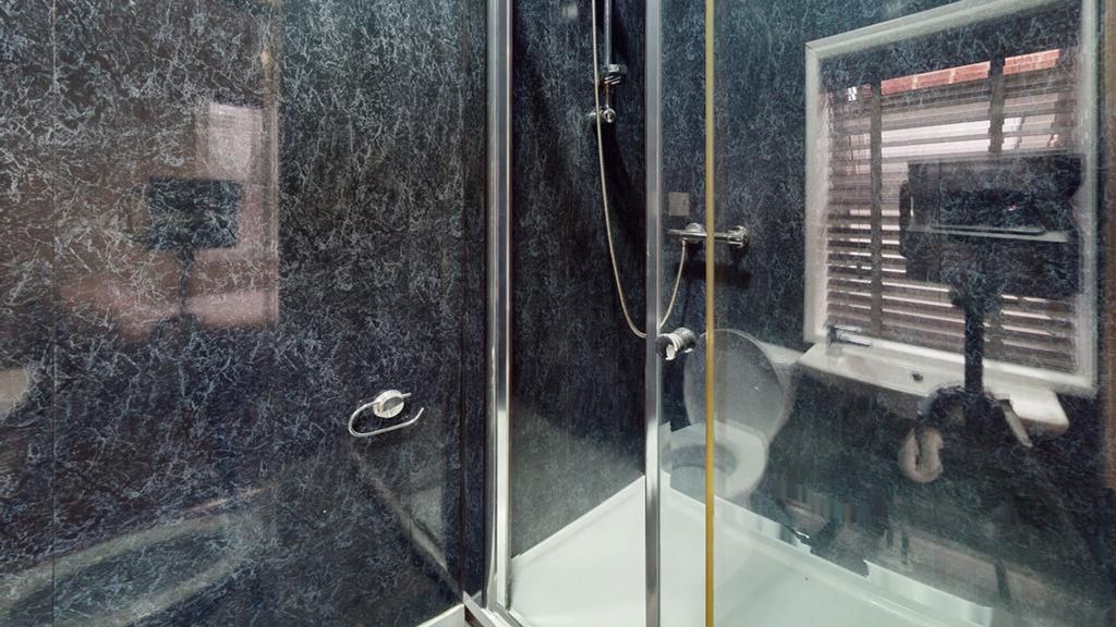 Property photo 1 of 14 A Modern And Stylish Bathroom Featuring A Sleek Sh...