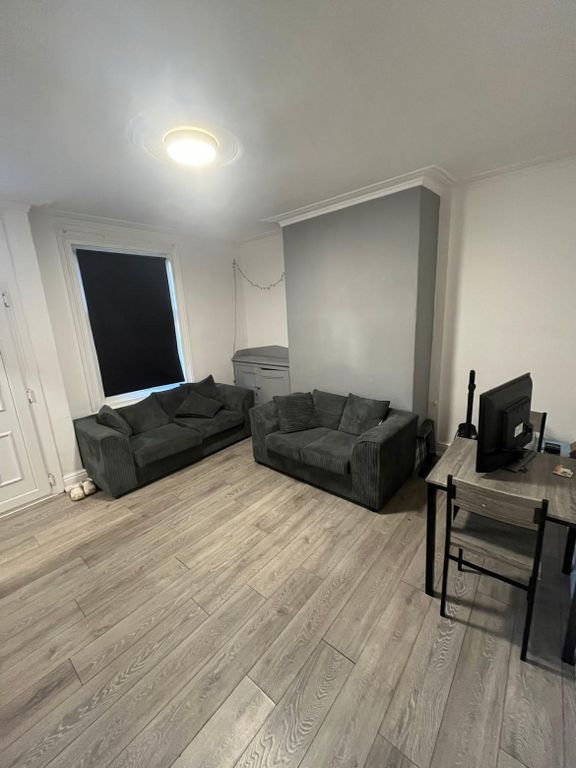 Property photo 1 of 31 Bright And Spacious Living Room Featuring Comforta...