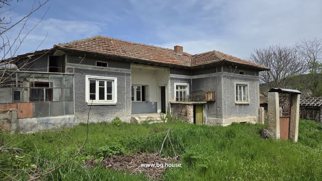 Property photo 1 of 66 Front View Of The Bulgarian Rural House Showing Grey Walls, Tiled Roof, And Surrounding Garden Area