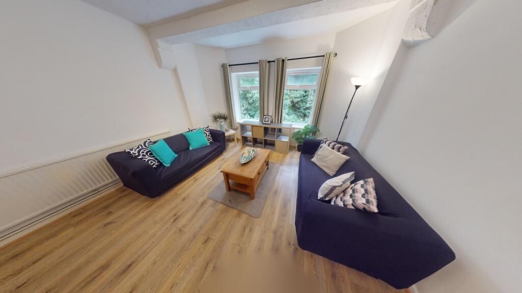 Property photo 2 of 10 Bright And Welcoming Living Room Featuring Light W...