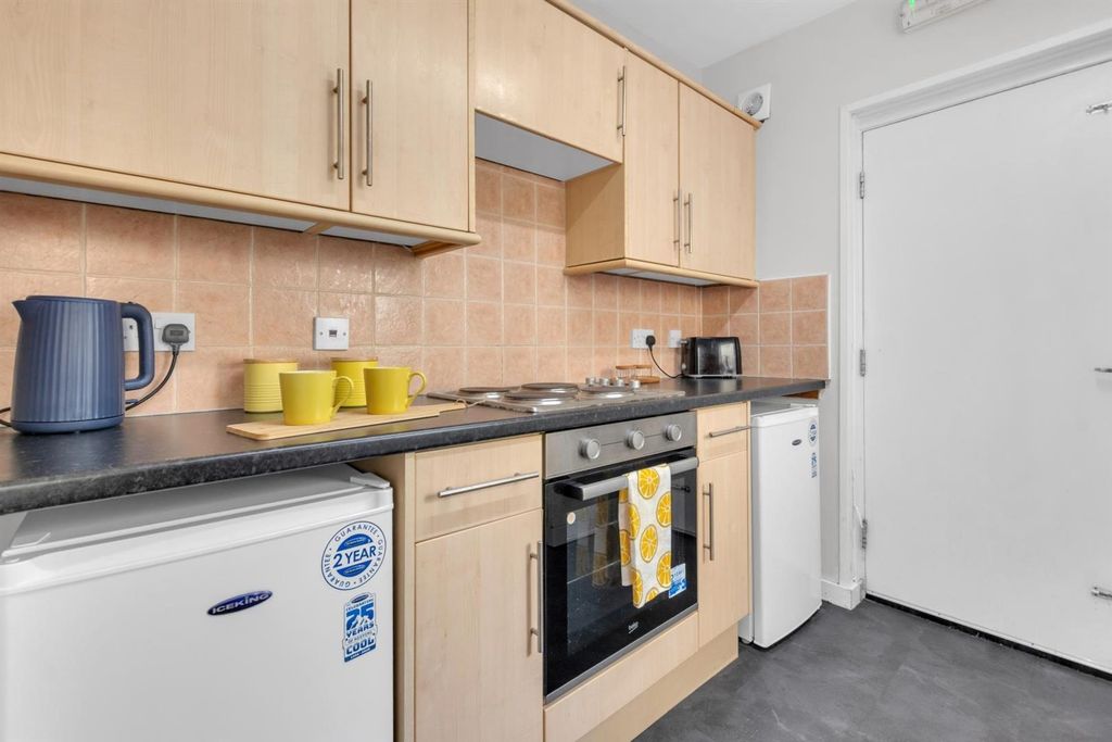 Property photo 3 of 11 Clean Modern Kitchen With Ample Storage Space...