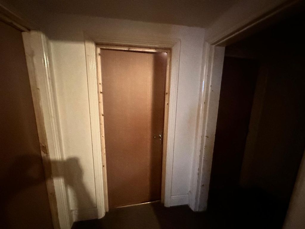 Property photo 2 of 17 A Well-Defined Hallway Featuring Clean Walls And d...