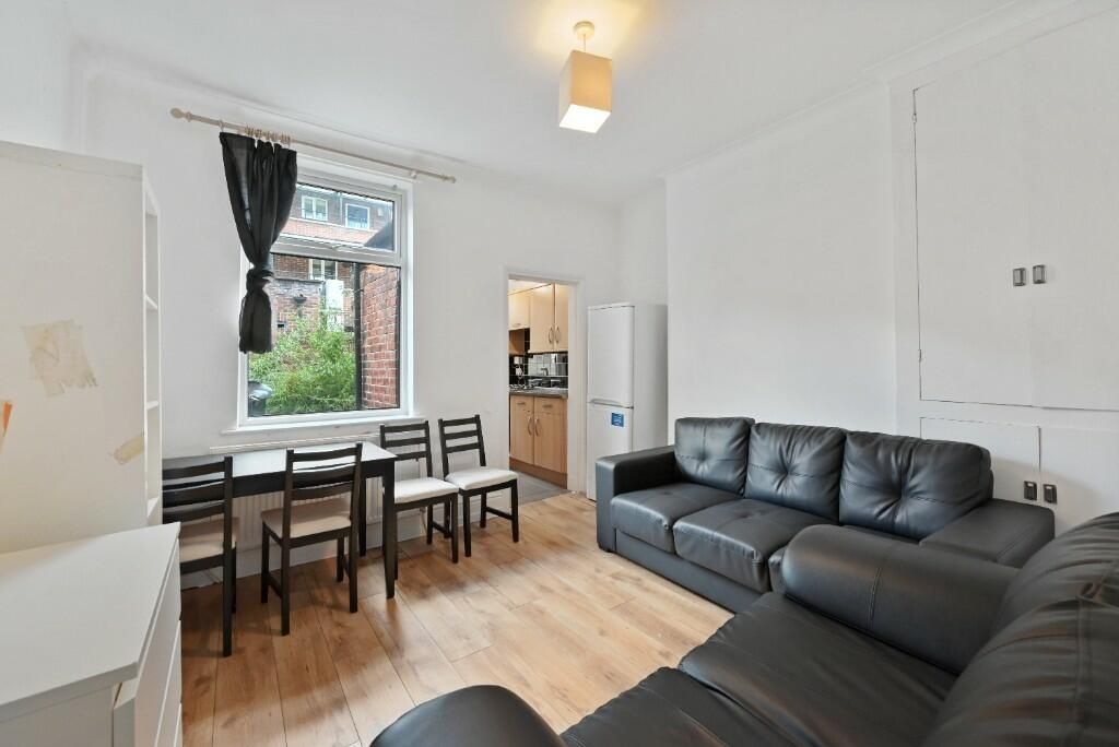 Property photo 2 of 13 Bright And Inviting Living Room Featuring Comforta...