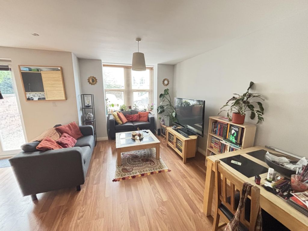 Property photo 2 of 13 Bright And Welcoming Living Room Featuring Comfort...