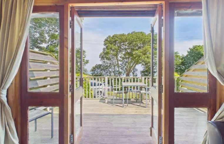 Property photo 3 of 9 French Doors Opening From The Lodge Onto The Sunny Decking Area