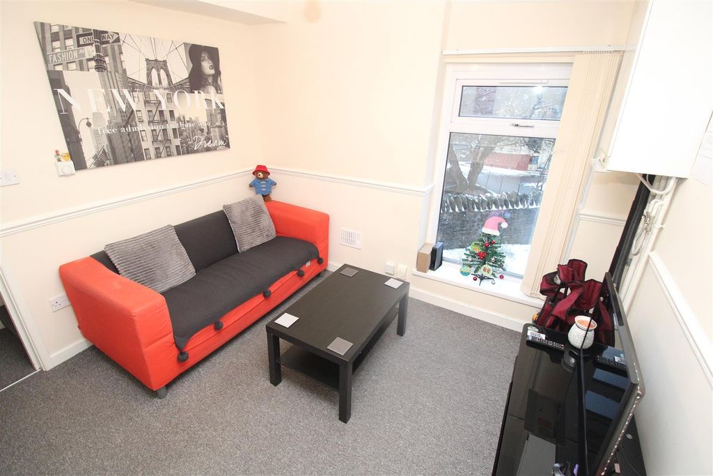 Property photo 1 of 6 Bright Lounge With A Modern Sofa And Coffee Table...