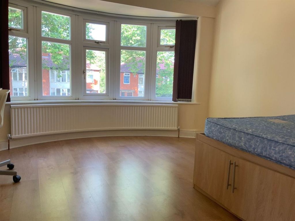 Property photo 1 of 10 A Bright And Airy Bedroom Featuring A Large Window...