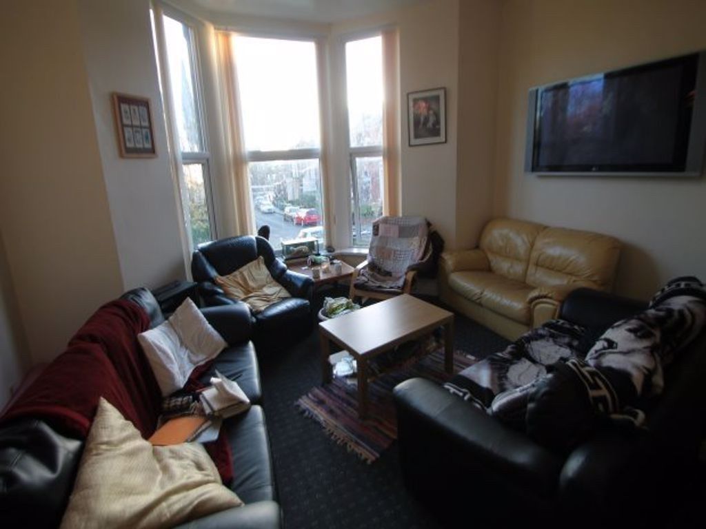 Property photo 3 of 12 A Cozy Living Room Featuring A mix Of Comfortable ...