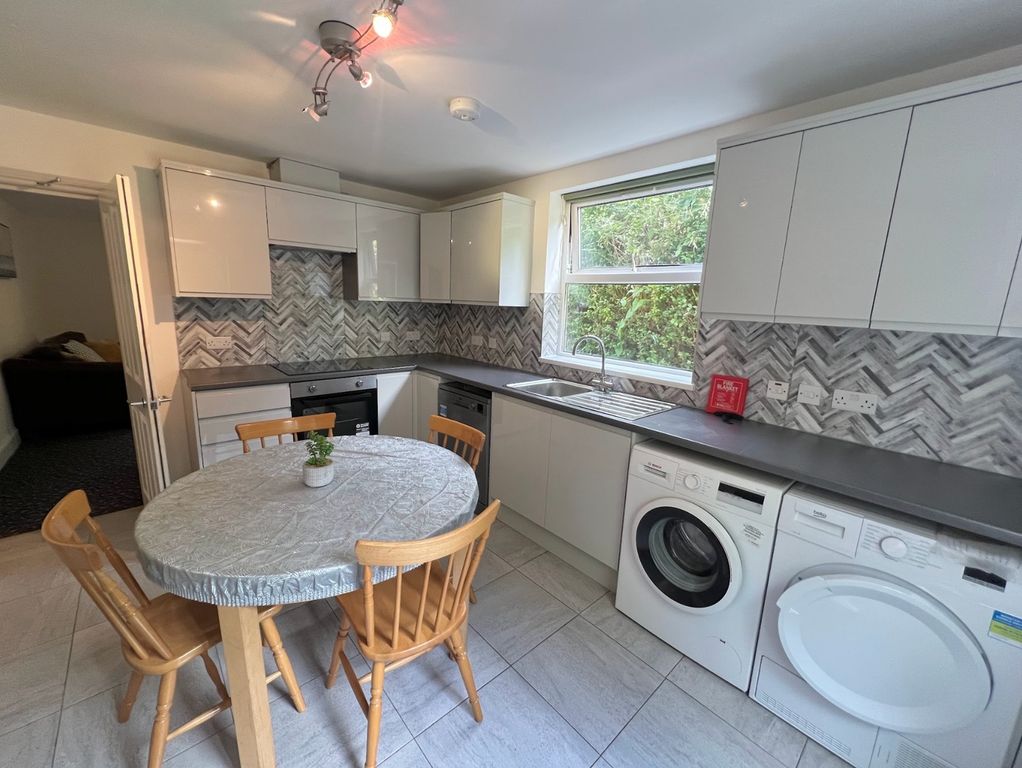 Property photo 1 of 16 A Bright And Modern Kitchen Featuring Ample Counte...
