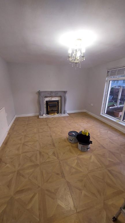 Property photo 2 of 5 Spacious And Well-Lit Living Room With A Large Win...