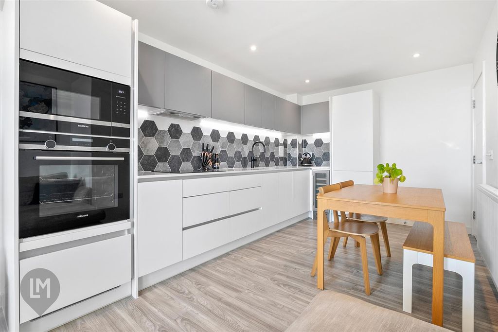 Property photo 3 of 7 Kitchen/Dining/Living