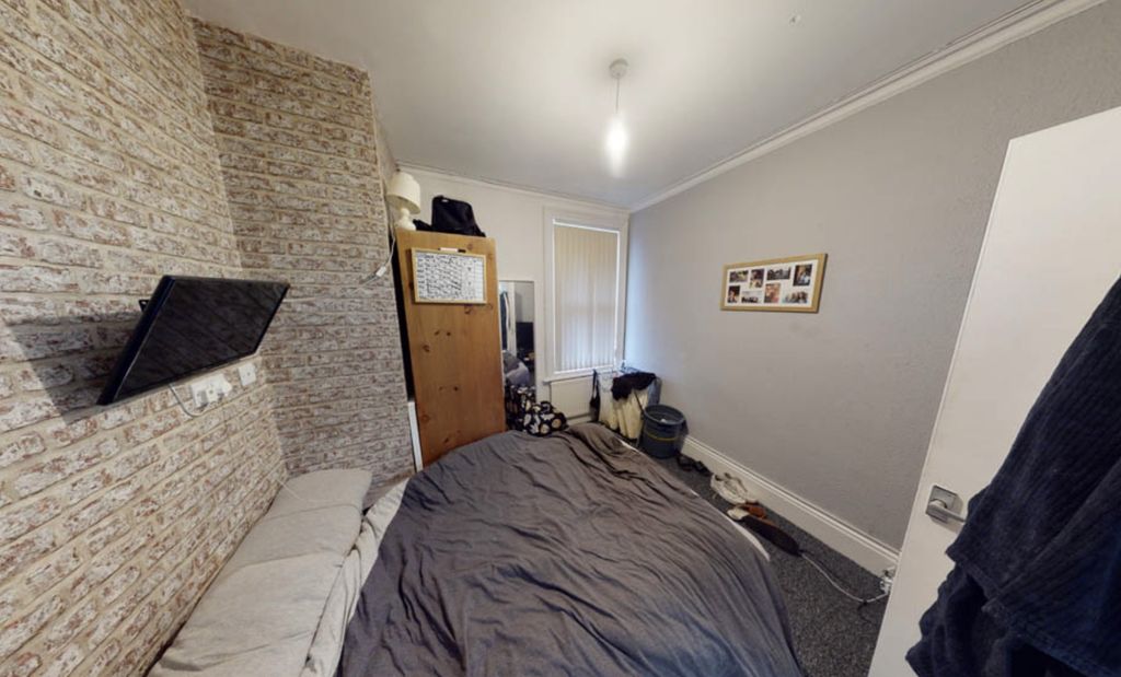 Property photo 2 of 7 A Cozy Bedroom With A Large Bed, Featuring A Windo...
