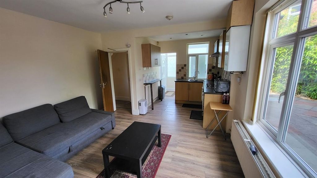Property photo 2 of 11 A Bright And Tidy Living Room With Ample Natural l...