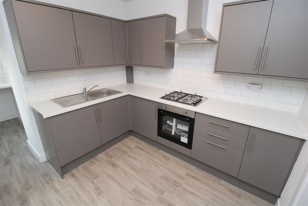 Property photo 1 of 24 Modern Kitchen With Sleek Grey Cabinets...