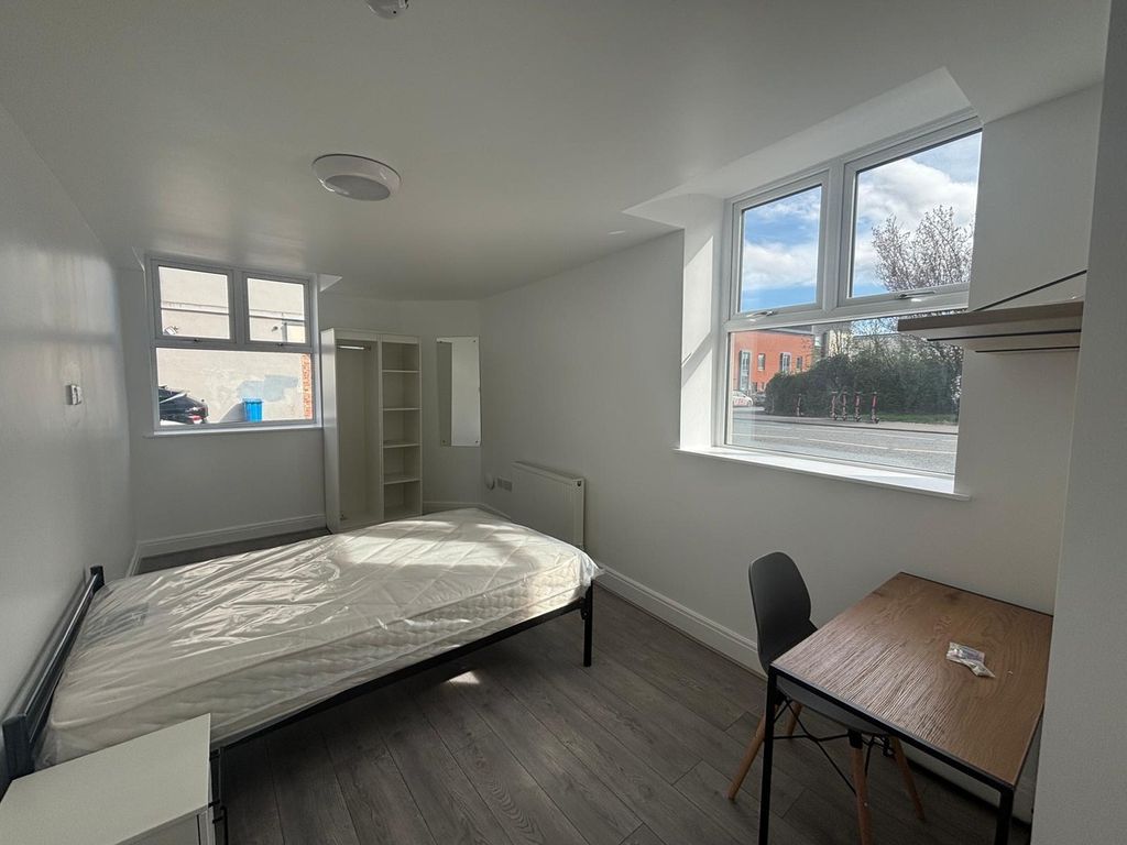 Property photo 2 of 9 Spacious Double Bedroom Featuring Large Windows Th...