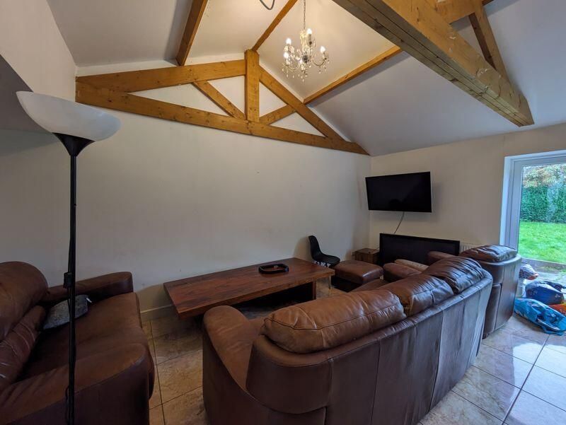 Property photo 2 of 15 A Spacious, Well-Lit Living Room With Comfortable ...