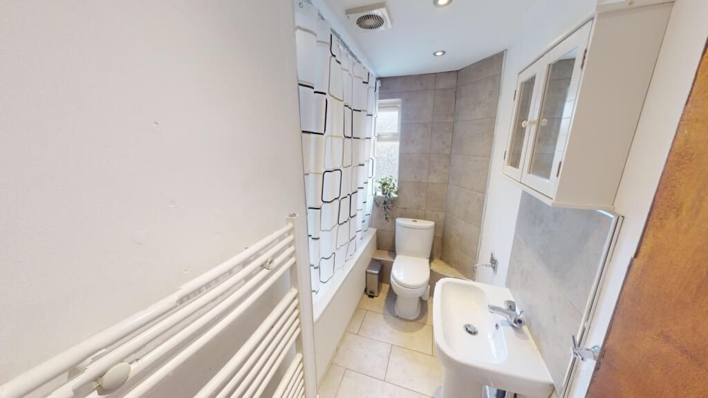 Property photo 3 of 10 A Clean And Functional Bathroom Featuring A White ...