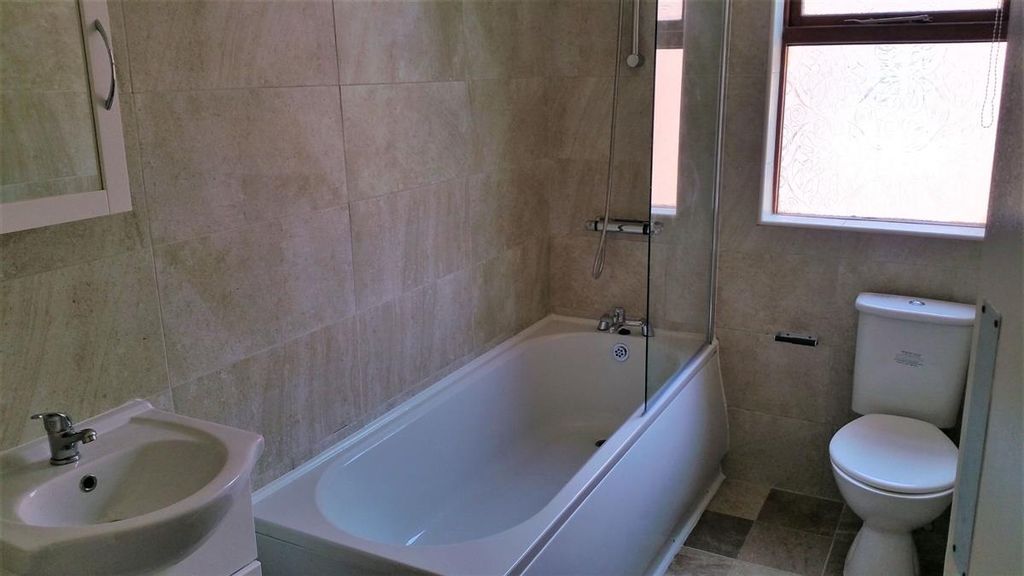 Property photo 3 of 3 Bright, Modern Bathroom With A Full-Size Bathtub A...