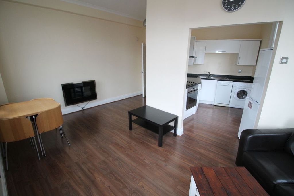 Property photo 2 of 8 Inviting Living Room Featuring A Modern Design Wit...