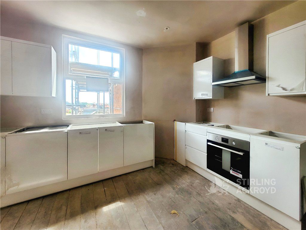 Property photo 3 of 8 Kitchen