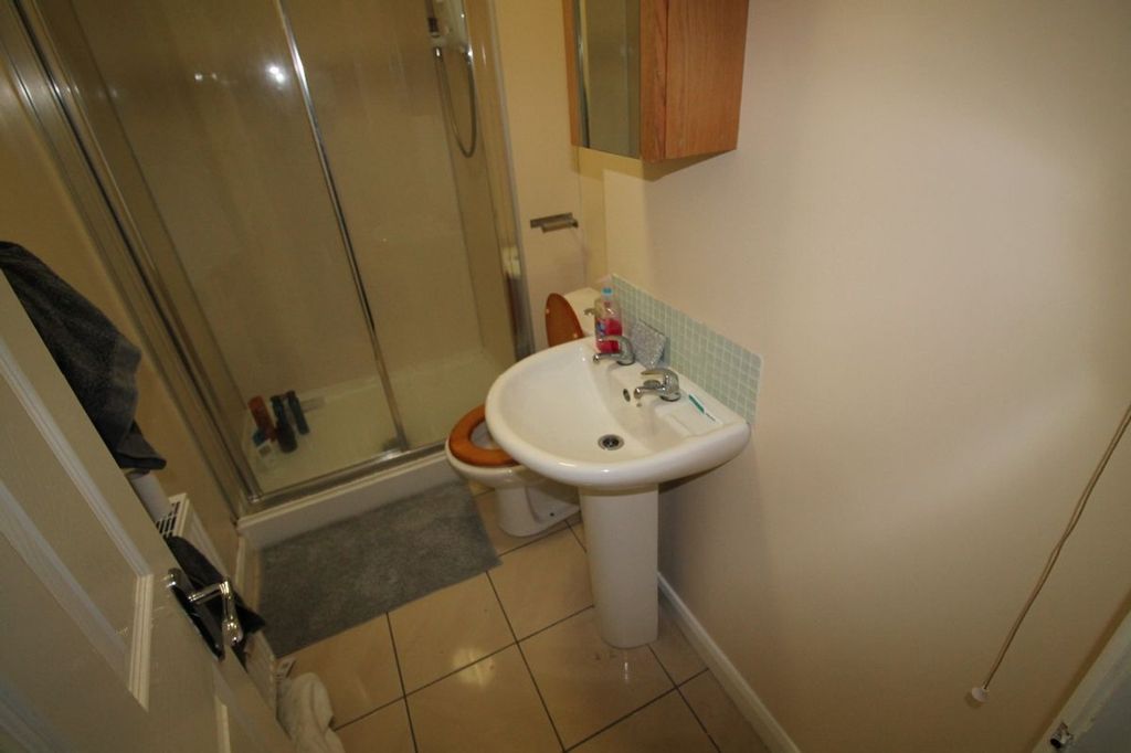 Property photo 1 of 10 This Well-Maintained Bathroom Features A Modern Sh...