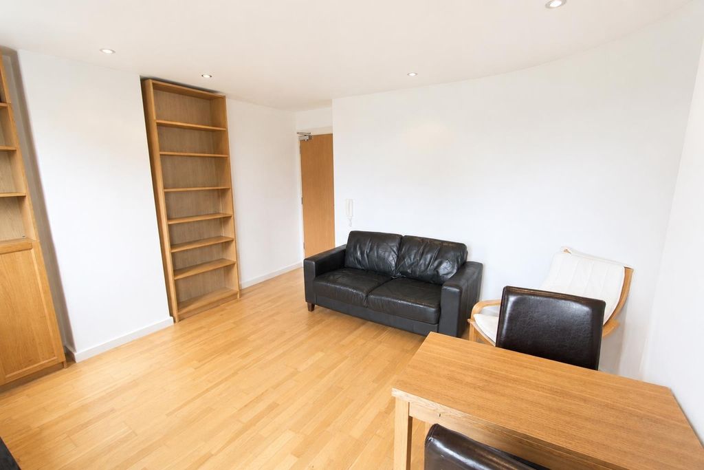 Property photo 3 of 9 Bright Living Area With Built-In Shelving...