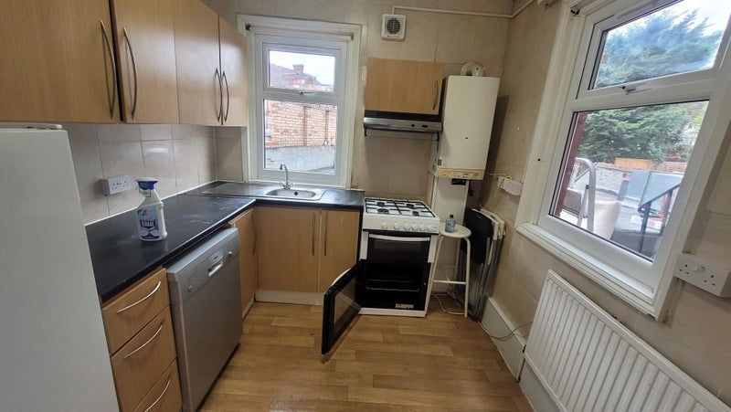 Property photo 3 of 4 Bright And Functional Kitchen Featuring Ample Natu...