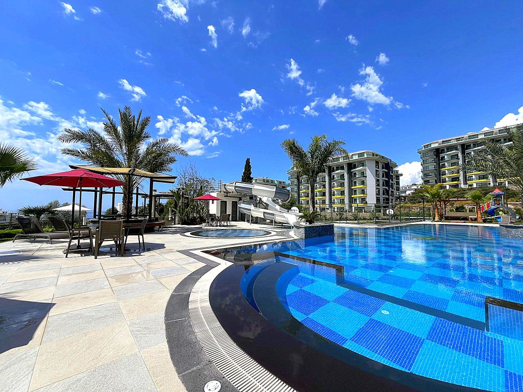 Property photo 1 of 27 Exquisite Fully Furnished Kargicak Apartment For Sale - View Of Hotel Concept Complex With Pools