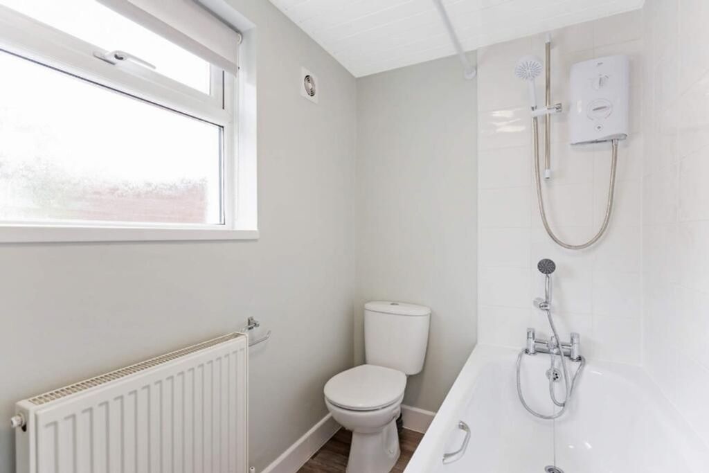 Property photo 2 of 14 A Stylish And Modern Bathroom Featuring A Sleek Ba...