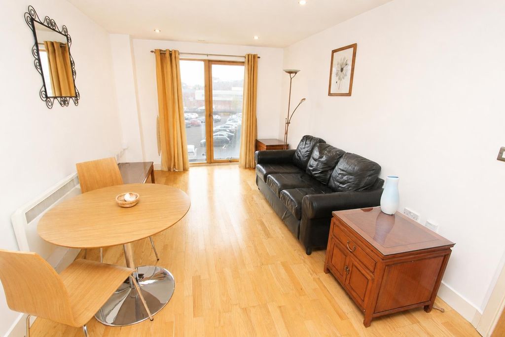 Property photo 1 of 7 Bright Lounge With Leather Sofa And Dining Area...