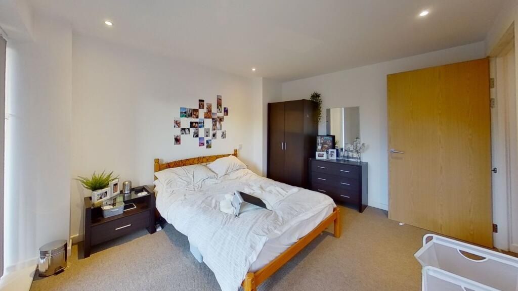 Property photo 3 of 7 Well-Lit Double Bedroom Featuring A Comfortable Do...
