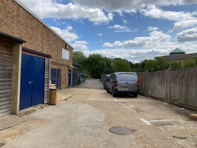 Property photo 3 of 6 Back Door And Drive.Jpg