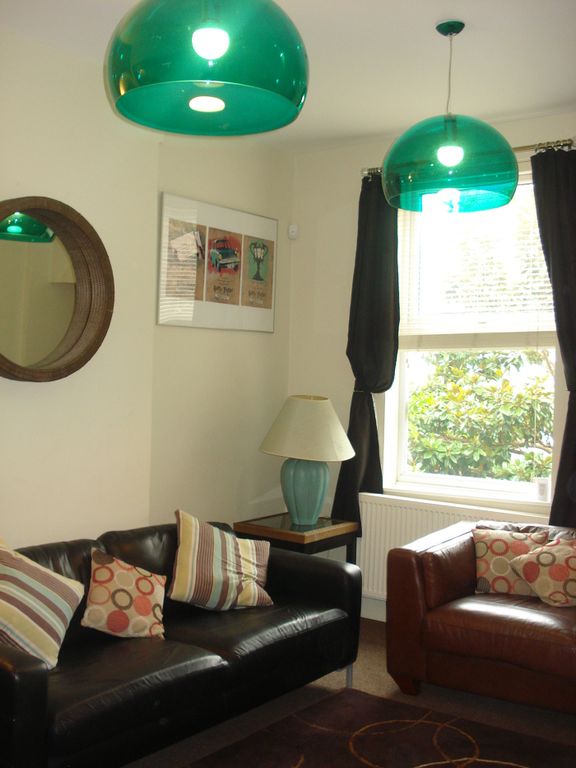Property photo 3 of 5 A Stylish And Inviting Living Room With Vibrant li...