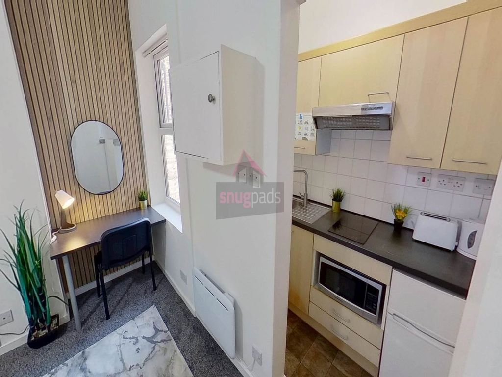 Property photo 3 of 7 Compact And Clean Kitchen With Modern Light Wood c...
