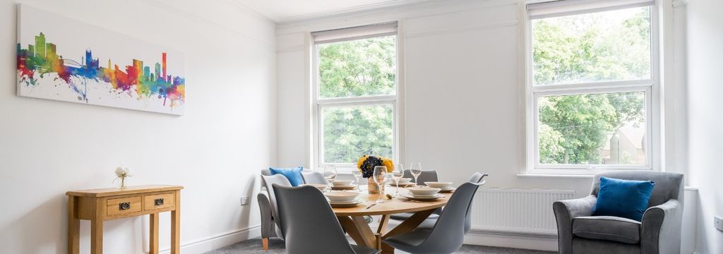 Property photo 1 of 15 Bright And Inviting Living Room Featuring Large Wi...