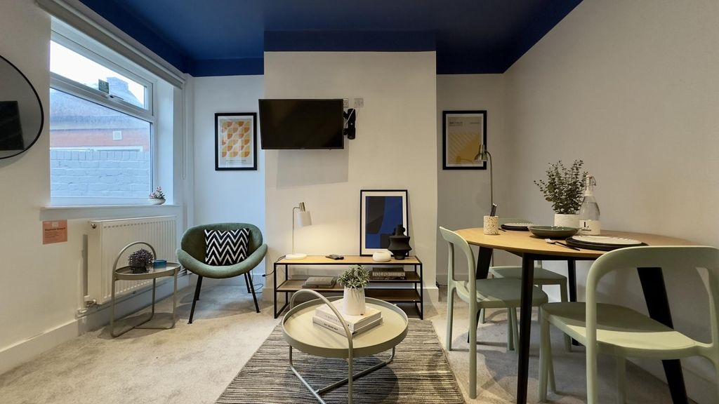 Property photo 1 of 8 A Stylish And Inviting Large Modern Living Room, P...