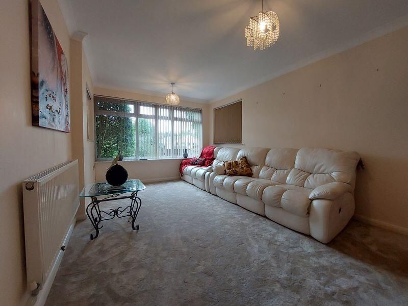 Property photo 3 of 11 A Spacious And Well-Maintained Living Room Featuri...