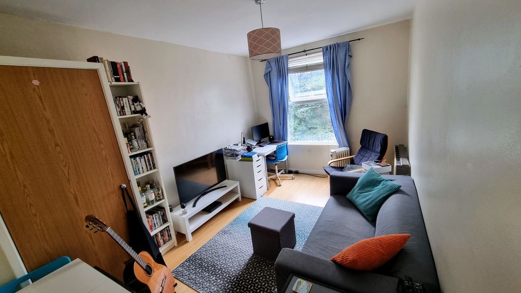 Property photo 1 of 6 A Cozy And Well-Maintained Living Room Featuring A...