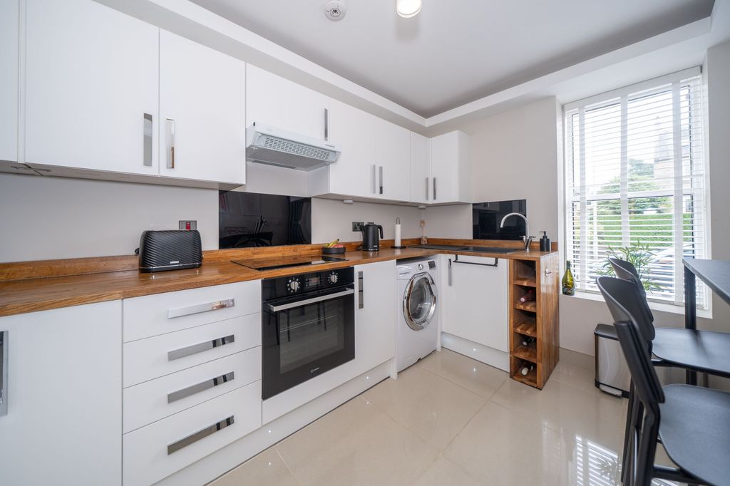 Property photo 3 of 12 Kitchen