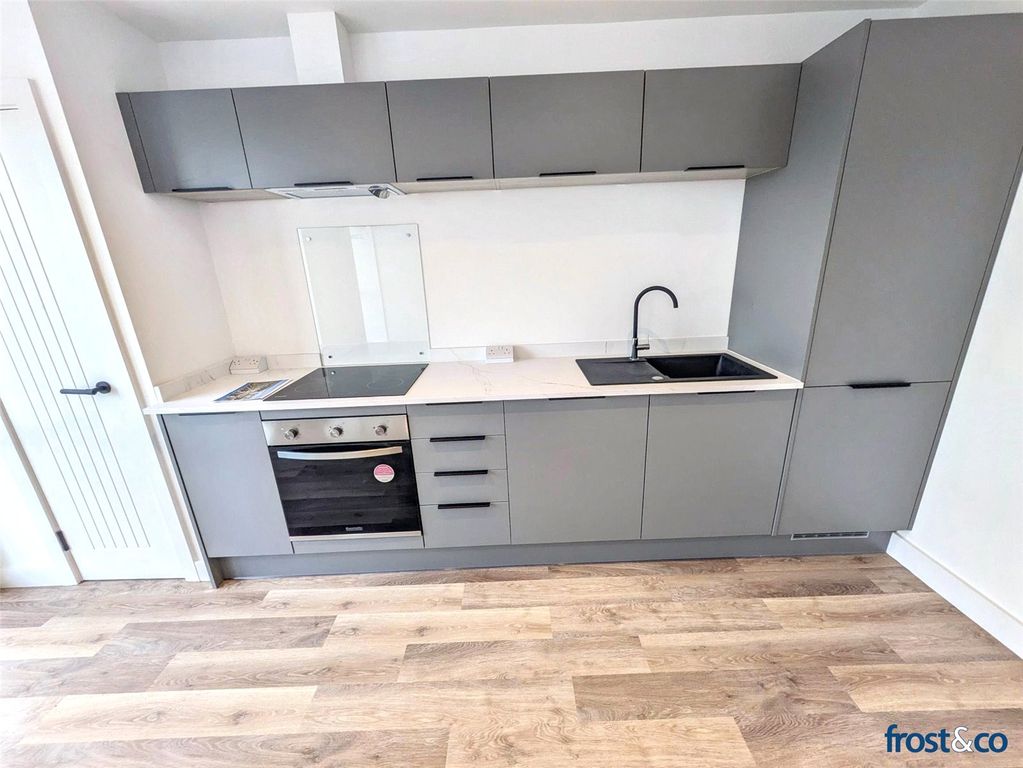 Property photo 3 of 7 Kitchen Area